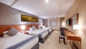 Al Safwah Royale Orchid Hotel - Mecca - Bedroom
