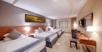 Al Safwah Royale Orchid Hotel - Mekka - Schlafzimmer