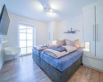 Südstrandhus Urlaub mit Hund Wohnung 2 unten - Borkum - Slaapkamer