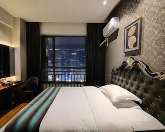 Kanglaibo Boutique Hotel Ganzhou - Ganzhou - Bedroom