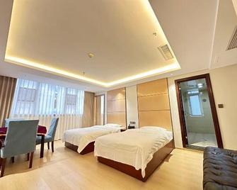 Enshi Xihe Business Hotel - Enshi - Habitación