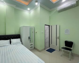 Hotel O Homestay Purirano - Kendari - Bedroom