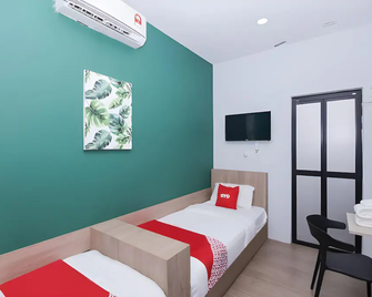 Hotel O Green Home Hotel - Sepang - Slaapkamer