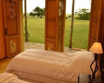 Alquimia Posada - Guichón - Habitación