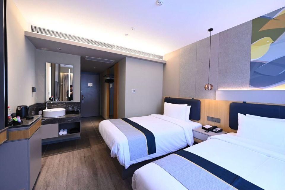 Home Inn Neo Beijing Ping'anli Metro Station - בייג'ין - חדר שינה