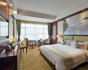 Grand Szechuan Hotel Vientiane - Vientiane - Bedroom