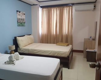 M2R Apartelle - Balasan - Habitación