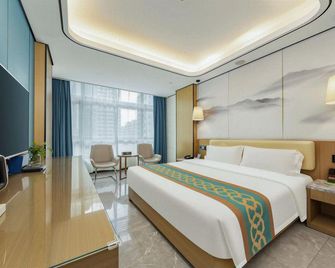 Wuzhishan International Therma Hotel - ไหโข่ว - ห้องนอน