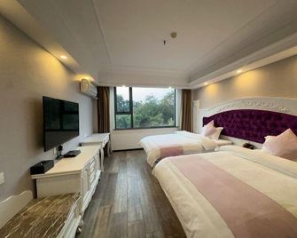 Milannuo Business Hotel - גילין - חדר שינה