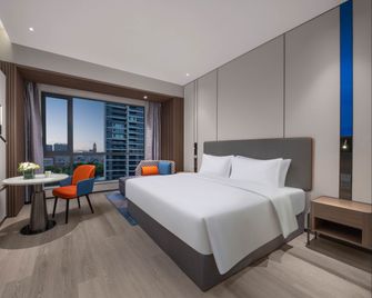Holiday Inn Express Hai'an Railway Station By IHG - Nantong - Slaapkamer