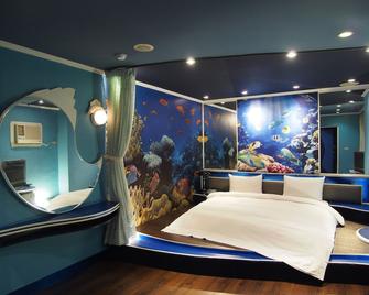 Day Chen Hotel - אילאן סיטי - חדר שינה