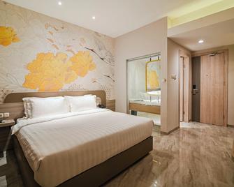 Yulia Hotel Managed By Hig - Gorontalo - Schlafzimmer