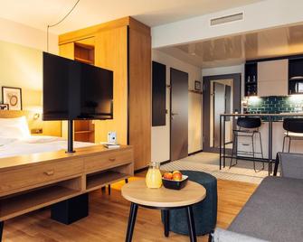 harry's home Villach hotel & apartments - Villach - Sala de estar