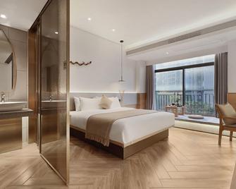 Sanmuli Hotel - Jiang Men - Спальня