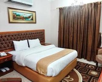 Bayan International Hotel - Al Murtafi‘ah - Bedroom