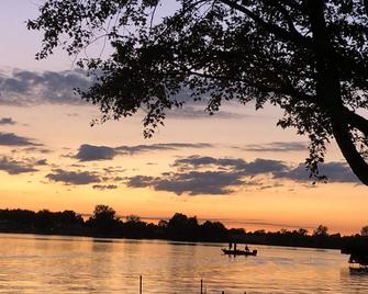 Spectacular sunset views and north chain lake front red cottage rental - Coldwater