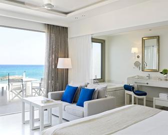 Knossos Beach Bungalows Suites Resort & Spa - Kokkini Hani - Wohnzimmer