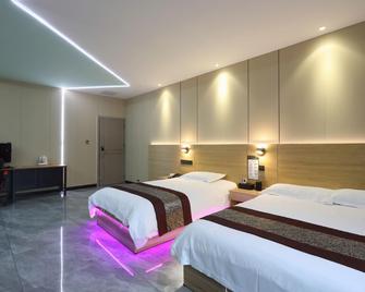 Zuo'an Soho Hotel - Shiyan - Schlafzimmer