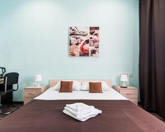 Hotel Business Tourist - Barnaul - Schlafzimmer
