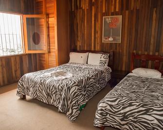 Pousada das Flores Premium - Campos do Jordao - Campos do Jordao - Schlafzimmer