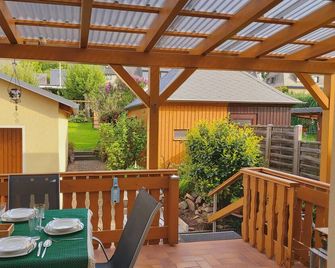 Fantastic vacation home with garden, terrace, playground & e-charging station - Bad Gottleuba - Patio