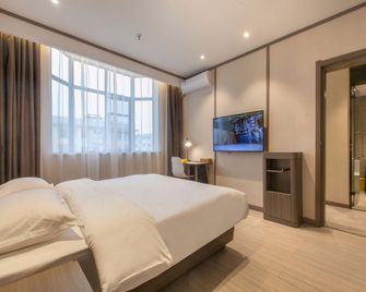 Hanting Hotel Zhijiang Yanjiang Avenue - Jingzhou - Schlafzimmer