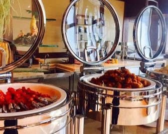 Changbaishan Luneng Resort Maplewood Chalet - Baishan - Buffet