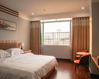 Xinfeng Silver Crystal Hotel - Shaoguan - Schlafzimmer