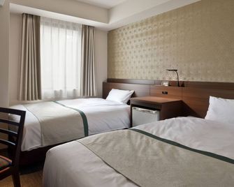 توسي هوتل كوكون كندا - طوكيو - غرفة نوم