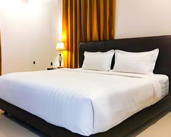 D'Kalora Hotel & Resort - Palu - Habitación