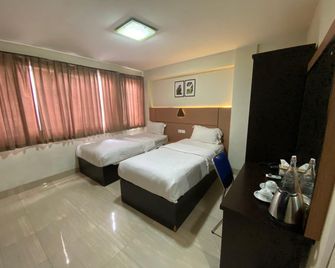 Lerina Hotel & Conference Syariah Banjarbaru - Banjarbaru - Schlafzimmer