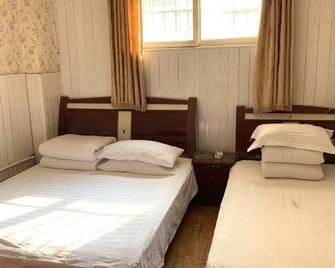 Shun Feng Yuan Hostel - Qingdao - Schlafzimmer