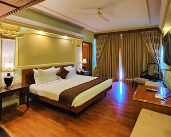 Hotel Tuli International - Nagpur - Slaapkamer