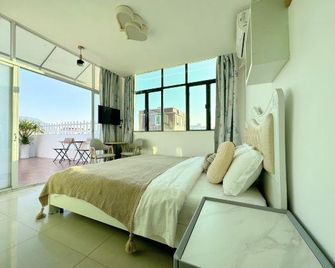 Shenzhen Dapeng Mancheng Theme Hostel - שנג'ן - חדר שינה