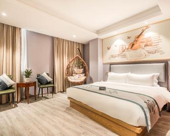 Xingdao Holiday Hotel (Shanghai wusong international Cruise Terminal) - Shanghai - Bedroom