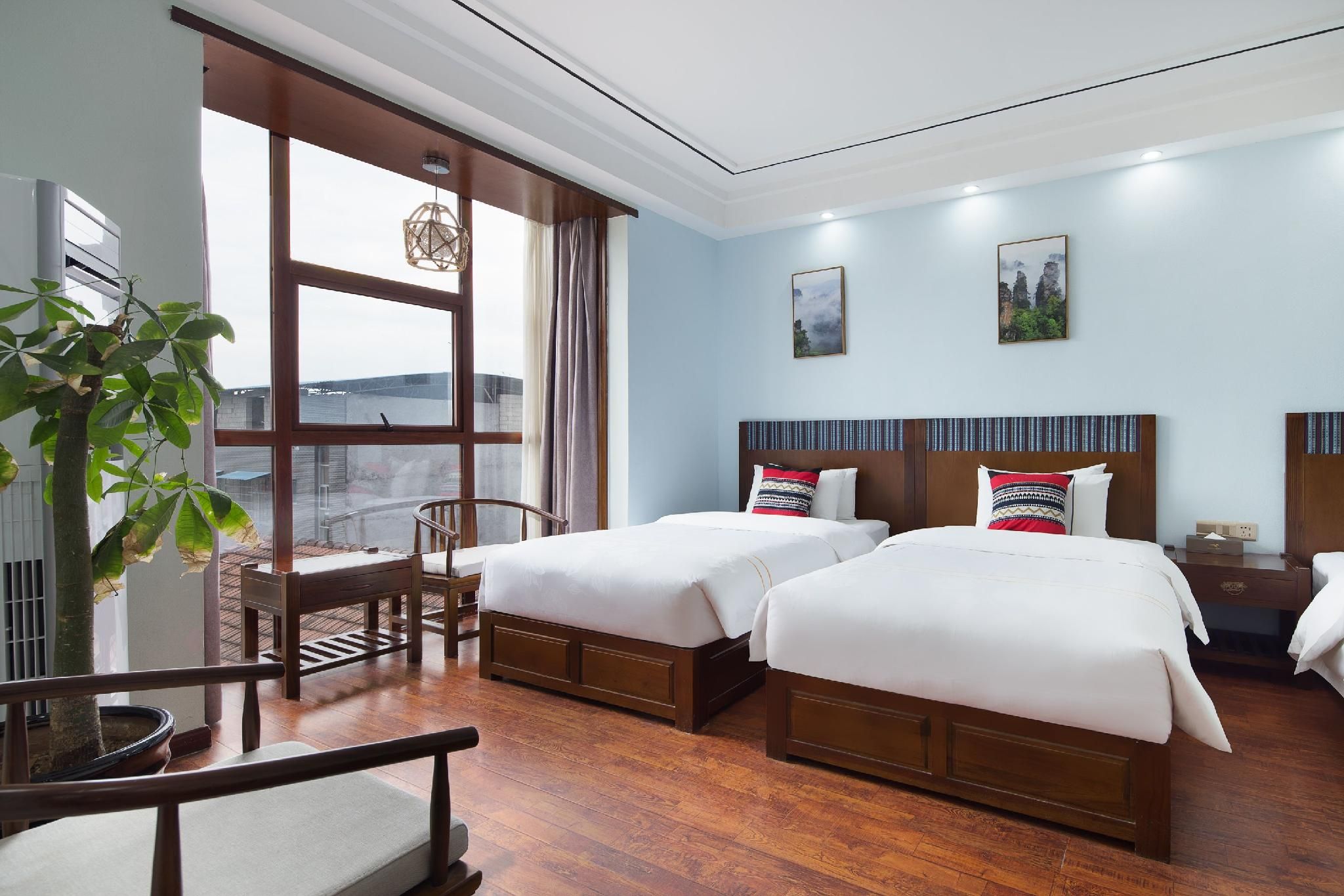 Zhangjiajie Debao Boutique Hotel - ג'אנגג'יאיי - חדר שינה