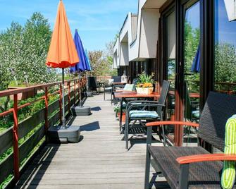 Cosy apartment for 4 people with WIFI, TV, terrace and parking - Friedrichskoog - Balcón