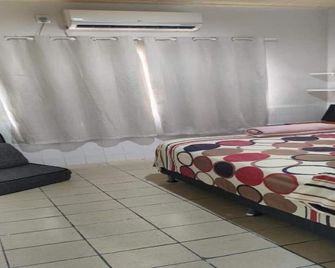 Your own home with 90m2, cozy and close to everything in Corumbá - كورامبا - غرفة نوم