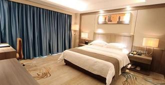 Centenio Kingdom Hotel - ฝอซาน - ห้องนอน