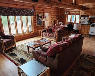 cozy lake house, full log cabin on beautiful shell lake, w/ wonderful loft. - Shell Lake - Living room