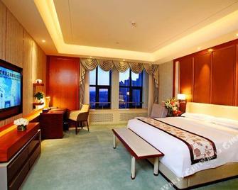 Xingan League Berun Hotel - Hinggan - Quarto