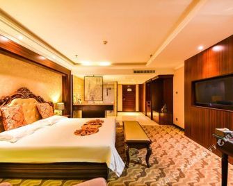 Shijiazhuang Ouyun Hotel (Chang'an Wanda Plaza & Municipal Obstetrics and Gynecology Hospital) - Shijiazhuang - Schlafzimmer