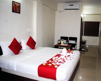 Hotel Wild Flower - Morvi - Bedroom