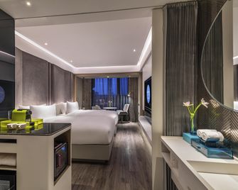 Novotel Yangzhou City Center - Yangzhou - Schlafzimmer