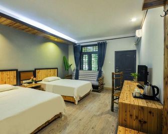 Xiangcun Dashijie Hostel - Nanning - Habitación