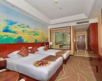 Huamei International Hotel (Longsheng Bus Station Store) - גילין - חדר שינה
