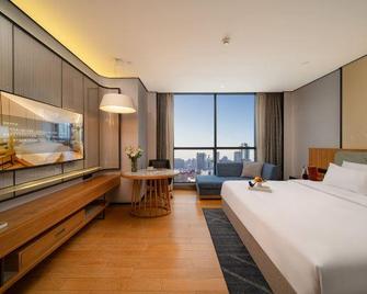 Earl Family Hotel (Tongling Beidouxing Cheng) - Tongling - Bedroom