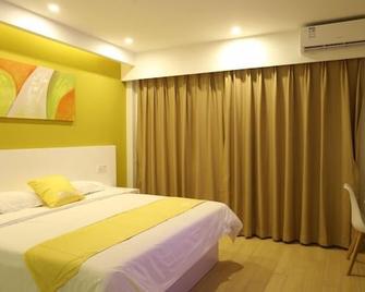Shell Qionghai Jinhai Road Hotel - Qionghai - Schlafzimmer