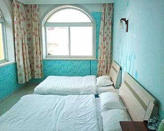 Da Lian Zheng Yuan Inn - Dalian - Bedroom