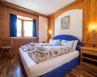 Comfort and tranquility inside the three-room Maloja apartment in Livigno - Livigno - Bedroom